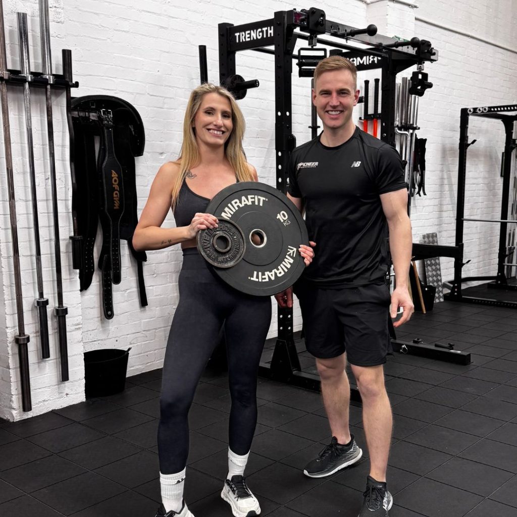 Client holding 12kg - their fat loss target